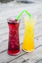 Juice mix berry, mango and passion fruit drink in tall glass with straw green color Royalty Free Stock Photo