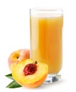 Juice is poured into a glass with a peach on a white background. Isolated