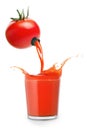 Juice pours from tomato into glass Royalty Free Stock Photo