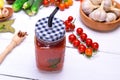 Juice from a ripe red tomato in a glass jar Royalty Free Stock Photo