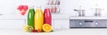 Juice smoothie orange smoothies in kitchen copyspace banner bottle fruit fruits Royalty Free Stock Photo