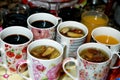 Juices, drinks and compotes tray on the iftar table in Ramadan month with dates, dried fruits figs, apricot, raisins compote