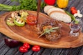 Juicy and appetizing steak tamogavok of horse meat on the table Royalty Free Stock Photo