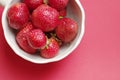Juicy appetizing strawberry in a cup on a red background Royalty Free Stock Photo