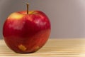 Juicy apple isoloated on gray background on the desk