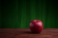 Juicy apple on a wood desk Royalty Free Stock Photo