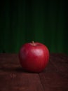 Juicy apple on a wood desk Royalty Free Stock Photo