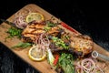 Juicy barbecue pork ribs beer, snacks lie on a wooden tray. Royalty Free Stock Photo