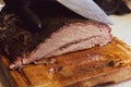 Juicy beef brisket on chopping block Royalty Free Stock Photo