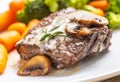 Juicy Beef Rib Eye Steak with mushroom sauce and baby vegetable Royalty Free Stock Photo