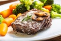Juicy Beef Rib Eye Steak with mushroom sauce and baby vegetable Royalty Free Stock Photo