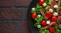 Juicy Beef Sirloin Steak Salad with roasted tomatoes, feta cheese and green vegetables in a black plate. healthy food Royalty Free Stock Photo