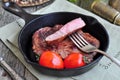 Juicy beef steak in a frying pan Royalty Free Stock Photo