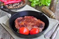 Juicy beef steak in a frying pan Royalty Free Stock Photo