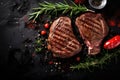 Juicy beef steak with rosemary on a dark background. Top view