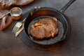 Juicy beef steak vintage cast iron frying pan Royalty Free Stock Photo