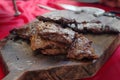 Juicy beef on a wooden board - making and cooking dish with beef