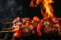 Juicy bloody steak on the grill.meat kebab shashlik on skewers and grilled, on fire background. Grilling meat. Juicy shashlik