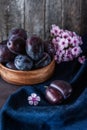 Juicy blue plum wood bowl with flowers of Phlox in a rustic style. Happy Thanksgiving. Copy the place.