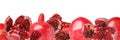 Juicy bright shiny pomegranate kernels on a white background