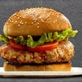 A juicy chicken burger with crisp lettuce, tomatoes and sesame-seeded buns by Generative AI