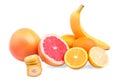 Juicy citruses on a white background. Nutritious banana and fresh grapefruits. Ripe oranges and lemons . Summer fruits.