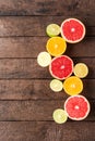 Juicy citruses on wooden background. Royalty Free Stock Photo