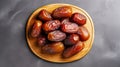 Juicy dates on a wooden piece