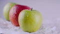 Juicy and delicious Apple lying on the table, fruit on the table. Apples on white background. The concept of healthy eating.