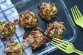 Juicy delicious balls of chopped broccoli and avocado rolled in fried bacon
