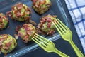 Juicy delicious balls of chopped broccoli and avocado rolled in fried bacon