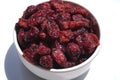 Juicy dried cranberries on white background