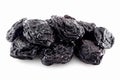 Juicy dried prunes on a white background