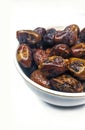 Juicy fasli dates in a bowl on white background Royalty Free Stock Photo