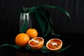 Juicy fiery oranges decorated with green leaves