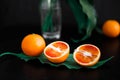 Juicy fiery oranges decorated with green leaves