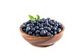 Juicy and fresh blueberries with green leaves on white bowl. Healthy eating Royalty Free Stock Photo