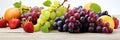 Juicy fresh grapes and assorted fruits on vibrant background. perfect for banners and ads