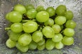 Juicy fresh green grapes in a plastic container after washing. Healthy routine concept. Cleaning fruits before use