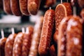 Juicy fresh meat sausages hang on the counter. Generative ai Royalty Free Stock Photo