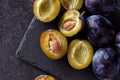 Juicy plums slice on dark background Royalty Free Stock Photo