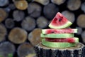 Juicy fresh red watermelon on the table. Watermelon sliced into pieces on a wooden texture background. Royalty Free Stock Photo