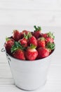 Juicy fresh strawberries in a metal bucket on a white background Royalty Free Stock Photo