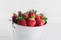 Juicy fresh strawberries in a metal bucket on a white background Royalty Free Stock Photo