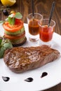 Juicy freshly grilled steak served with chili sauce and vegetables Royalty Free Stock Photo