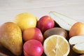 Juicy fruit close-up, healthy foods, diet ingredients, kiwi slices near lemon and juicy peaches Royalty Free Stock Photo