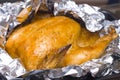 Juicy golden chicken in foil