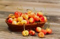 Juicy Golden Rainier Cherries in Basket on Rustic Wood Royalty Free Stock Photo