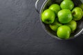 Juicy green apple in stainless steel colander on Dark grey black slate background Royalty Free Stock Photo