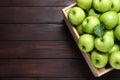 Juicy green apples in crate on table, top view. Space for text Royalty Free Stock Photo